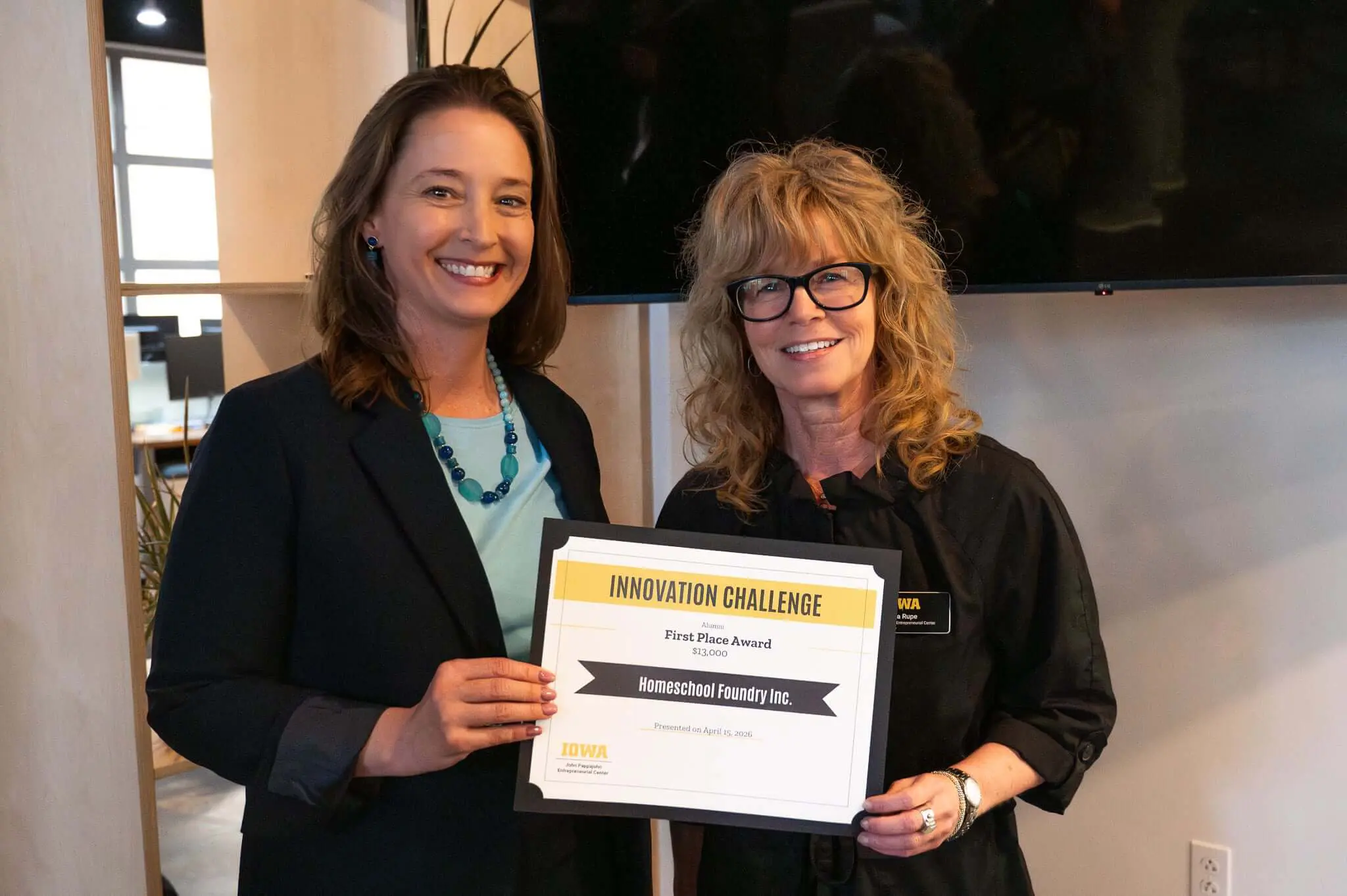 Jen Myers receiving the $13,000 pitch competition award for Homeschool Foundry